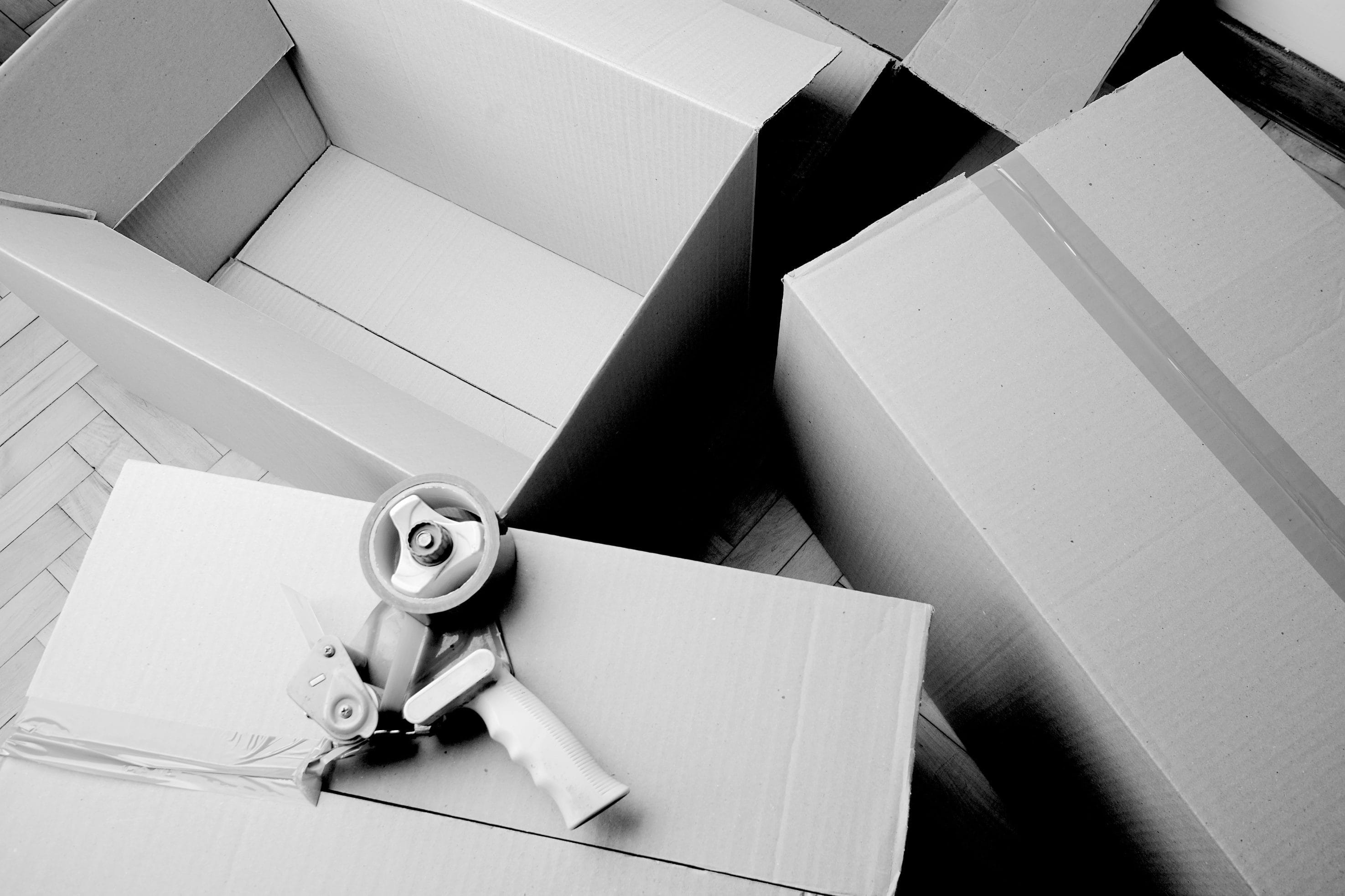 Packing Supplies Including Large Cardboard Boxes and Tape Dispenser
